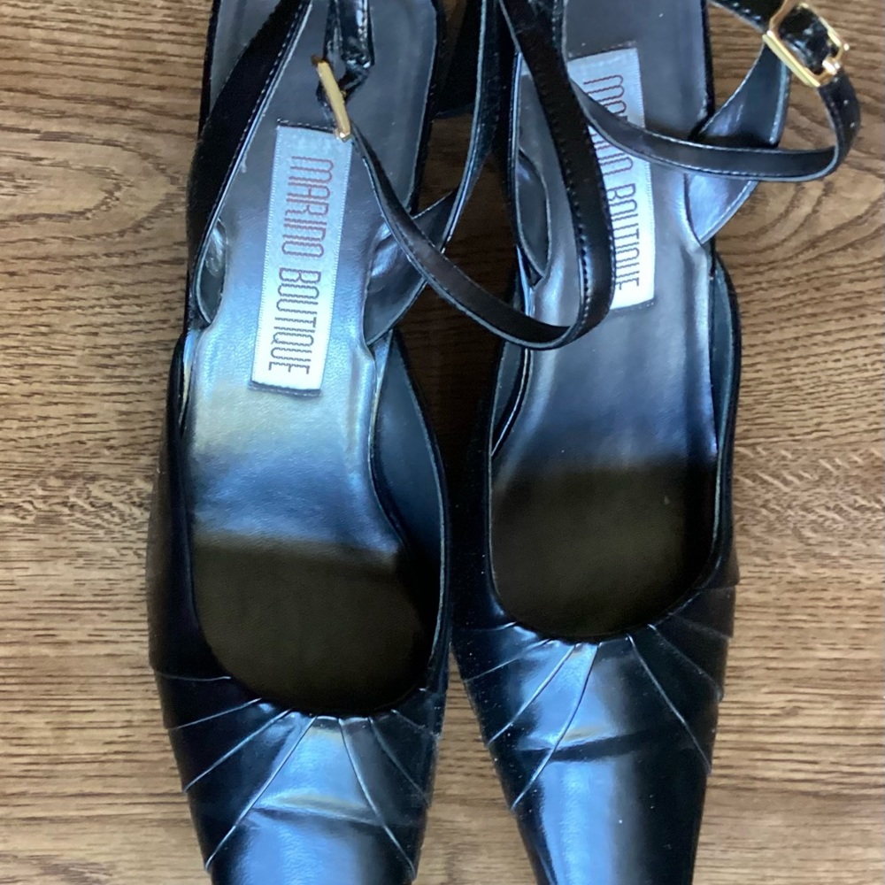 Black high-heel sling with adjustable ankle strap.